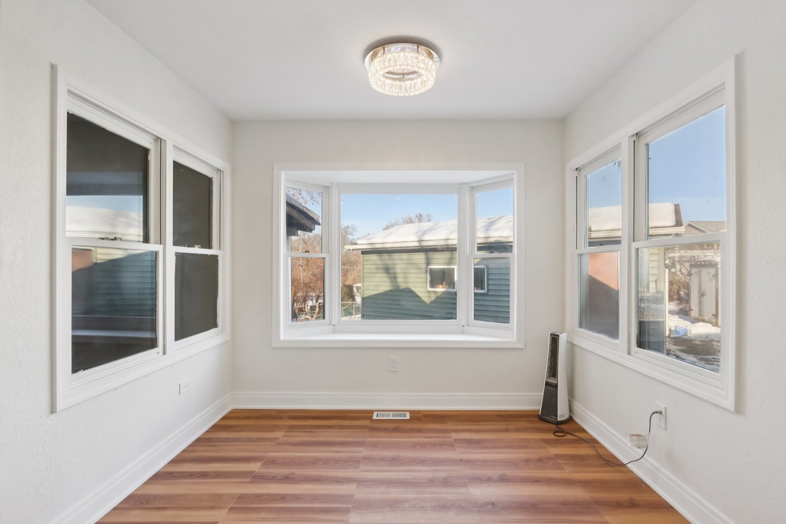 26814 North Genesee Street Wauconda, IL 60084 - Photo 14 of 34 a view of an empty room with wooden floor and a window