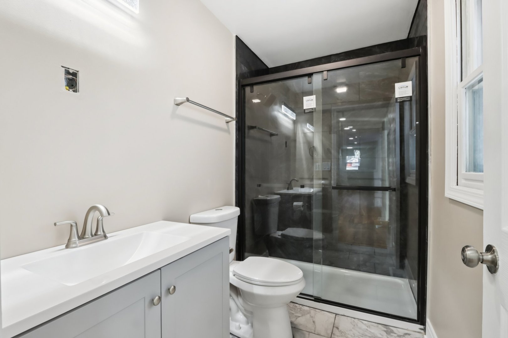 26814 North Genesee Street Wauconda, IL 60084 - Photo 25 of 34 a bathroom with a shower sink vanity and toilet