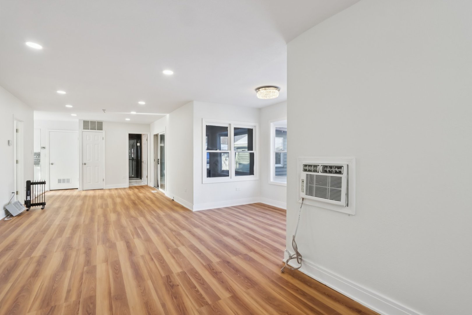 26814 North Genesee Street Wauconda, IL 60084 - Photo 7 of 34 a view of an empty room with window and wooden floor