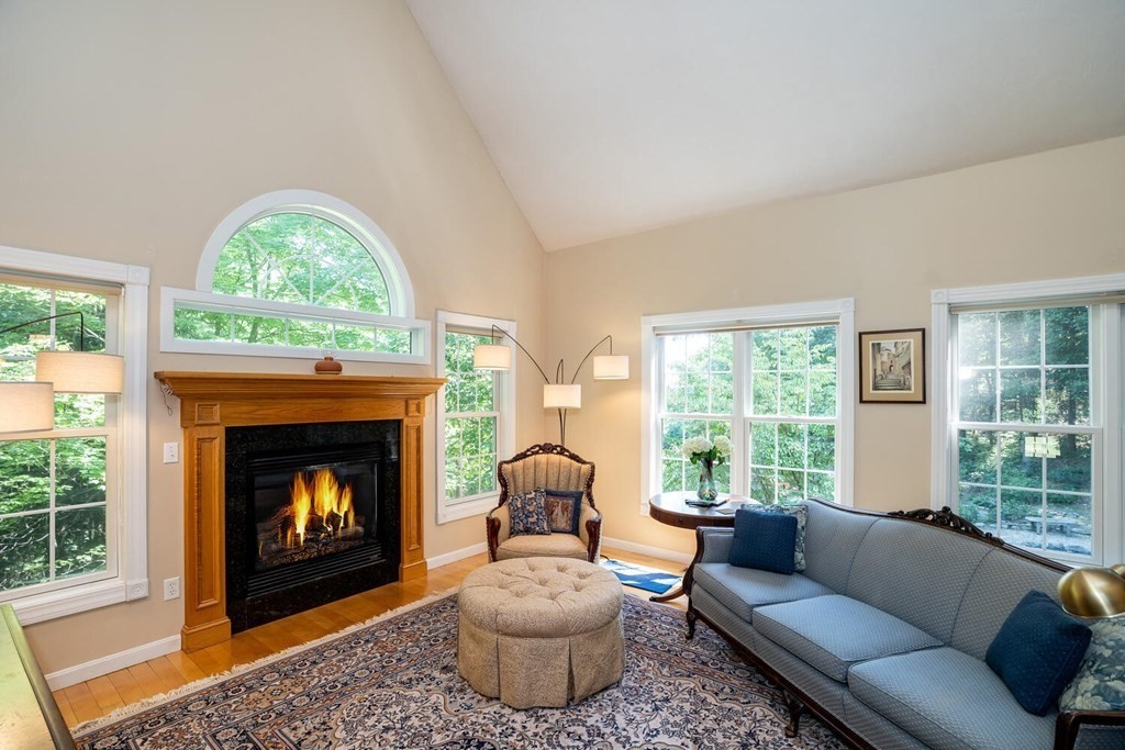 150 East Leverett Road Amherst, MA 01002 - Photo 16 of 42 a living room with furniture a window and a fireplace