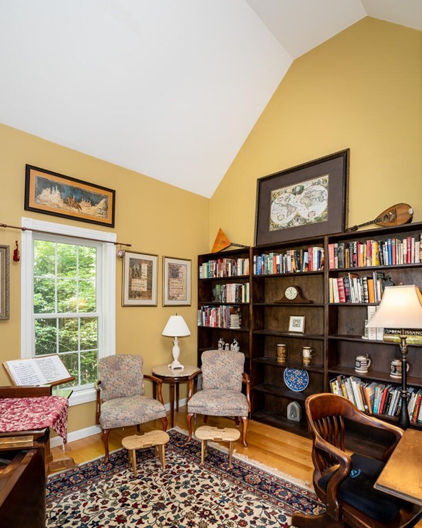 150 East Leverett Road Amherst, MA 01002 - Photo 24 of 42 a living room with furniture a bookshelf and a window