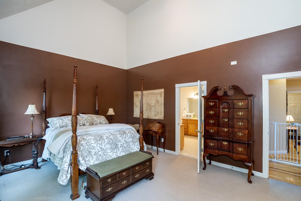 150 East Leverett Road Amherst, MA 01002 - Photo 29 of 42 a bedroom with a bed and a television