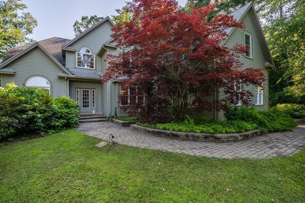 150 East Leverett Road Amherst, MA 01002 - Photo 10 of 42 a front view of a house with garden