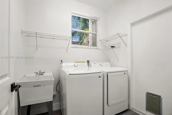 a utility room with dryer and washer