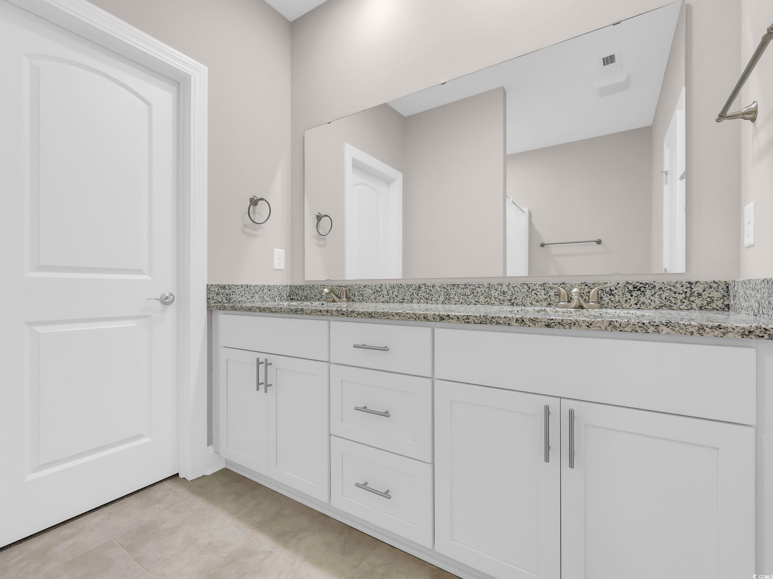 344 Kiskadee Loop Conway, SC 29526 - Photo 11 of 23 Bathroom featuring double vanity and light tile patterned floors