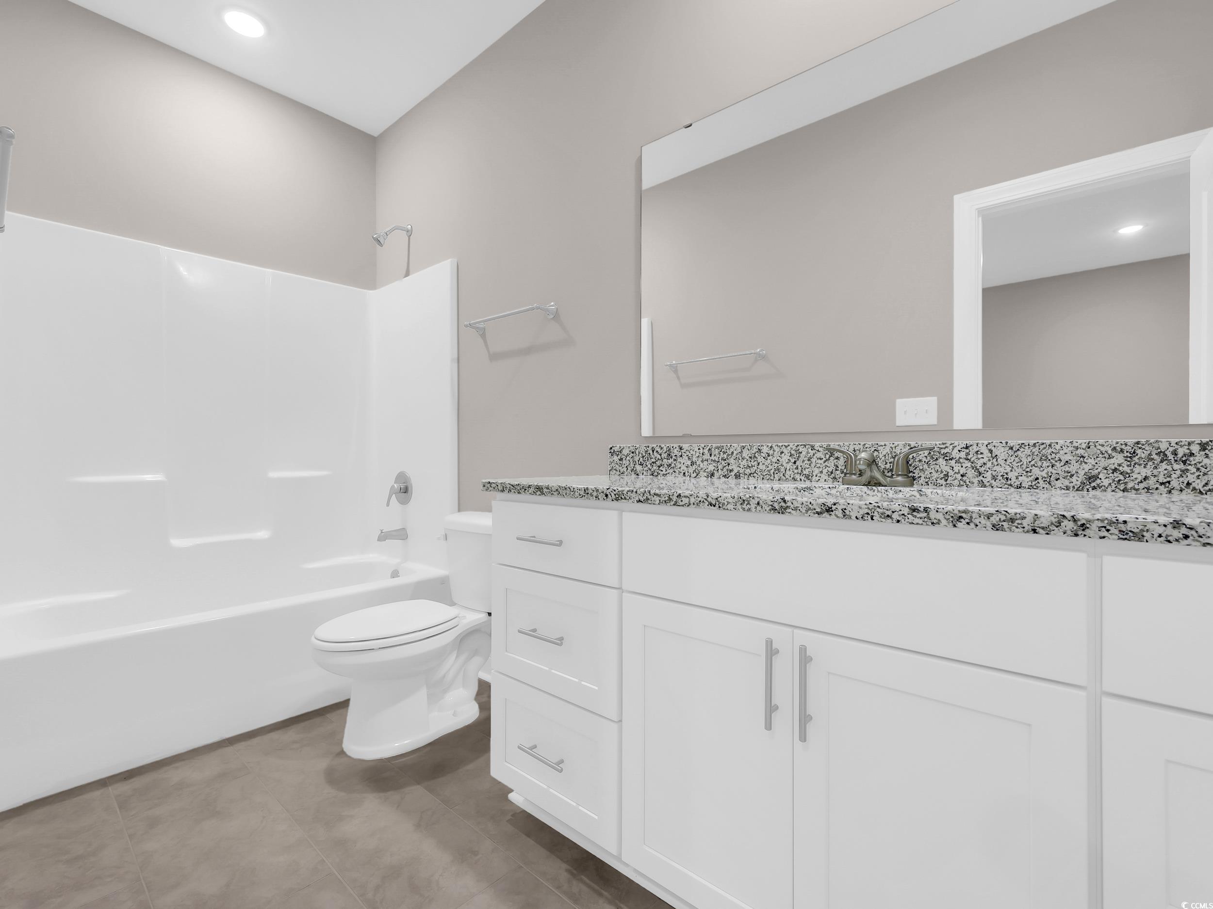 344 Kiskadee Loop Conway, SC 29526 - Photo 12 of 23 Bathroom with shower / bath combination, vanity, recessed lighting, and dark tile patterned floors