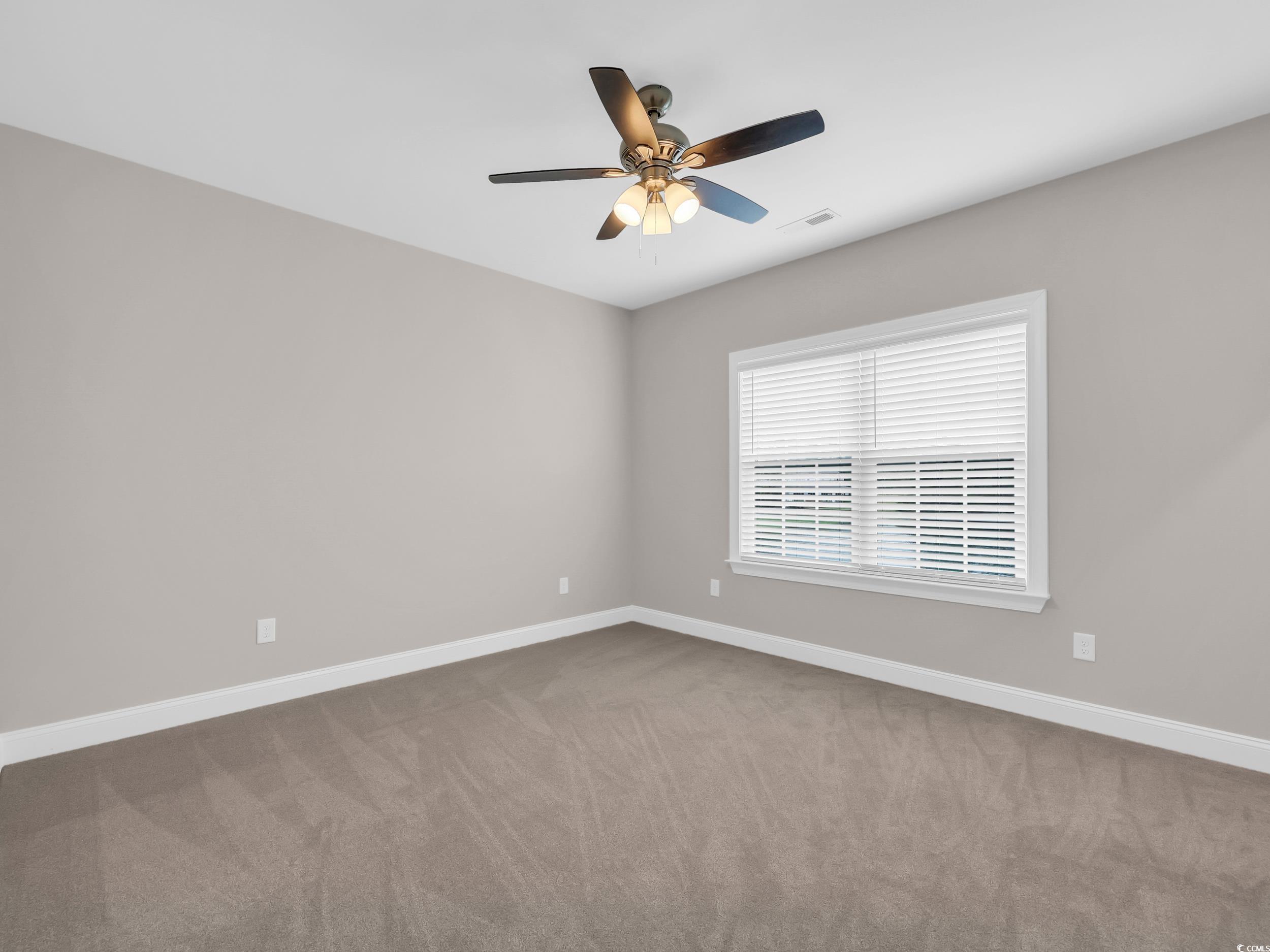 344 Kiskadee Loop Conway, SC 29526 - Photo 14 of 23 Empty room with light colored carpet and a ceiling fan