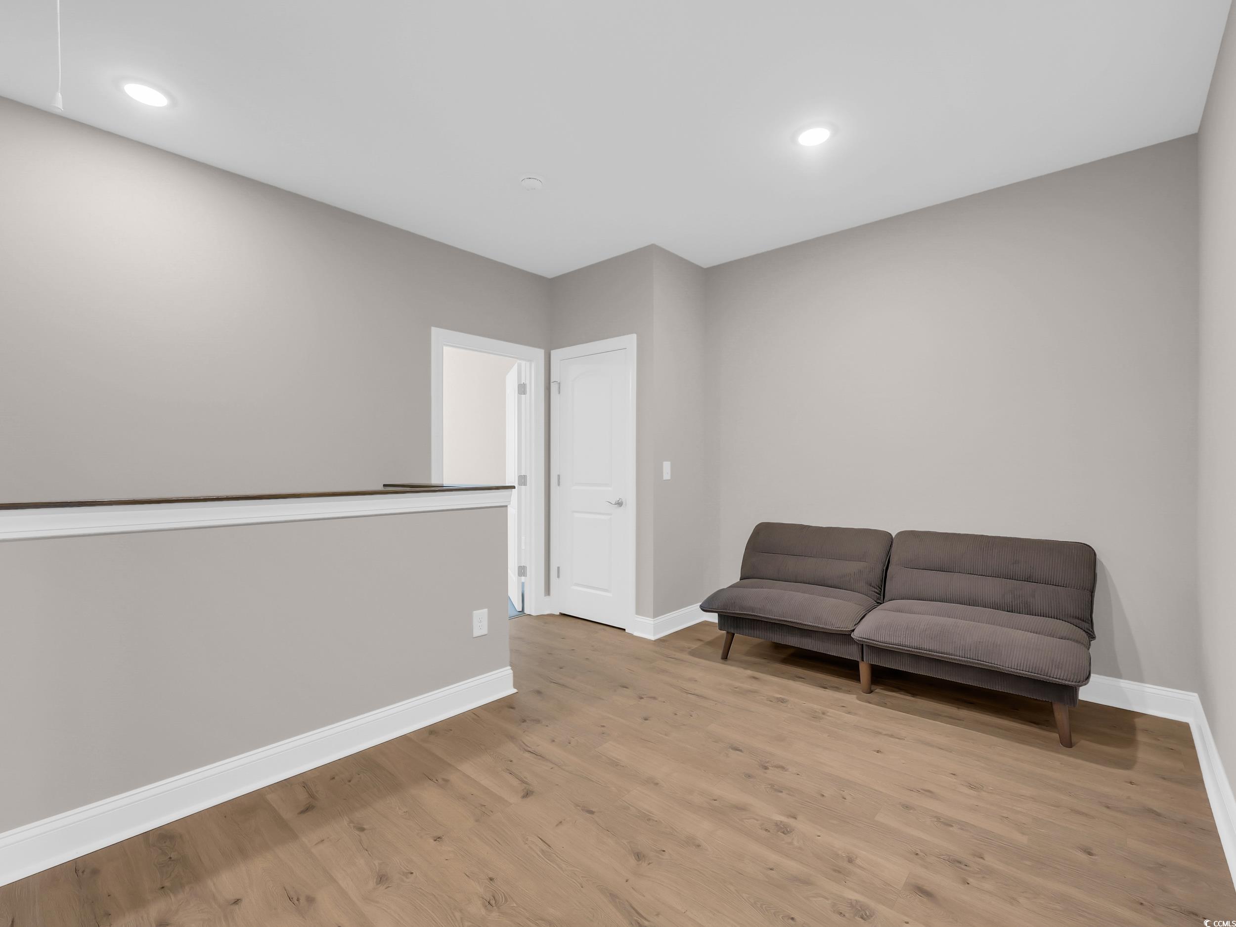 344 Kiskadee Loop Conway, SC 29526 - Photo 23 of 23 Living area with light wood-style flooring and recessed lighting