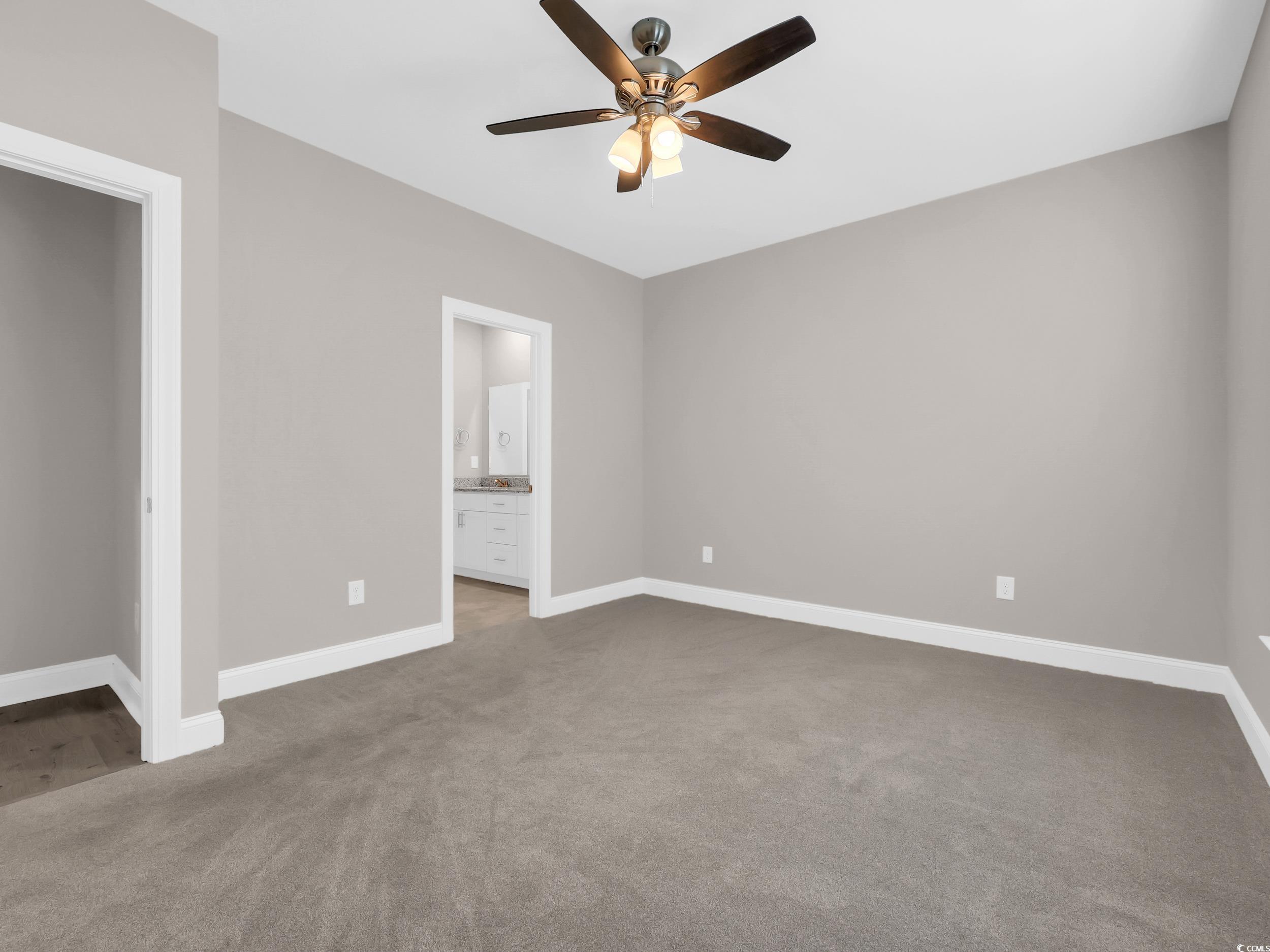 344 Kiskadee Loop Conway, SC 29526 - Photo 9 of 23 Unfurnished bedroom with carpet floors, ceiling fan, and ensuite bath