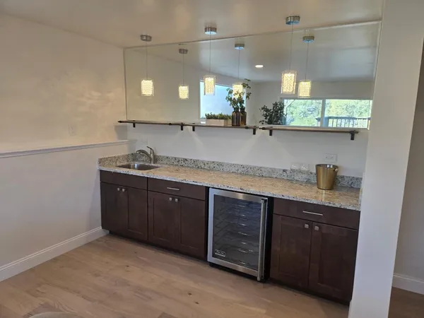 a bathroom with a sink vanity and mirror