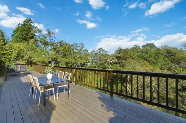 a view of a balcony with chairs