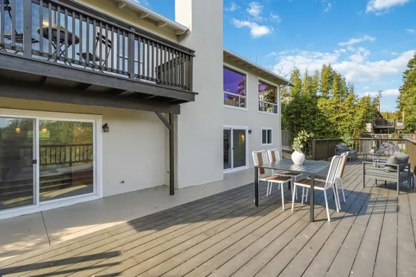 a view of a balcony with chairs