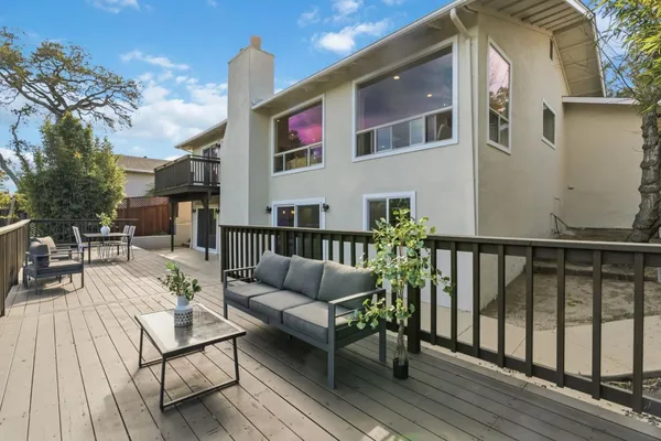 a aerial view of a house with a yard and potted plants