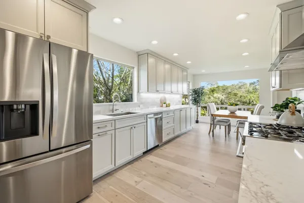 a bedroom with a bed and a potted plant