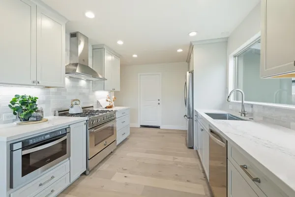 a bedroom with a bed and a potted plant