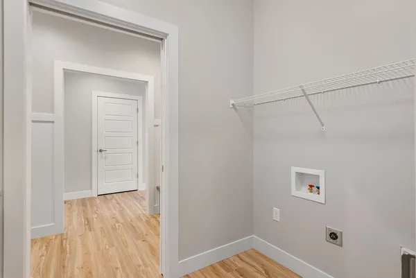 a bathroom with a granite countertop sink and white cabinets