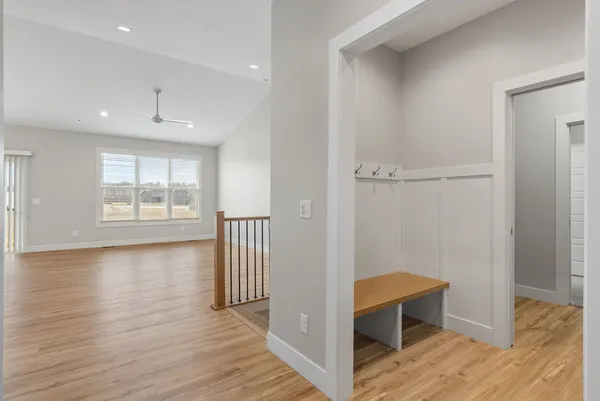 an empty room with a empty space and windows