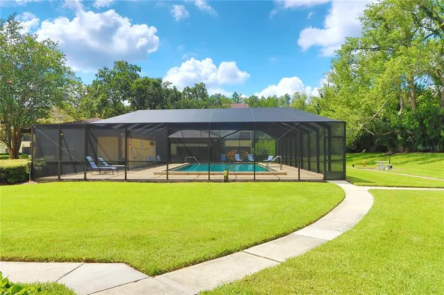a room with pool table and chairs