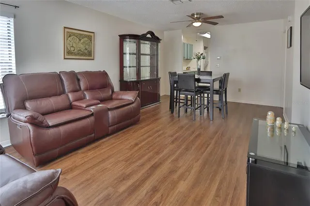 a view of a dining room with furniture and wooden floor
