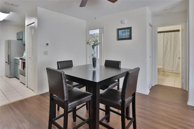 a dining room with furniture and wooden floor