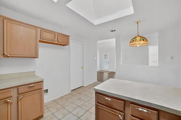 a kitchen with a sink and a window