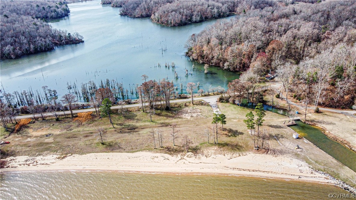 Lot 10 Sunken Meadow Rd Spring Grove Spring Grove, VA 23881 - Photo 1 of 15 a view of a of water with large trees