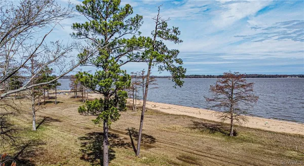 a view of a water and beach in the back
