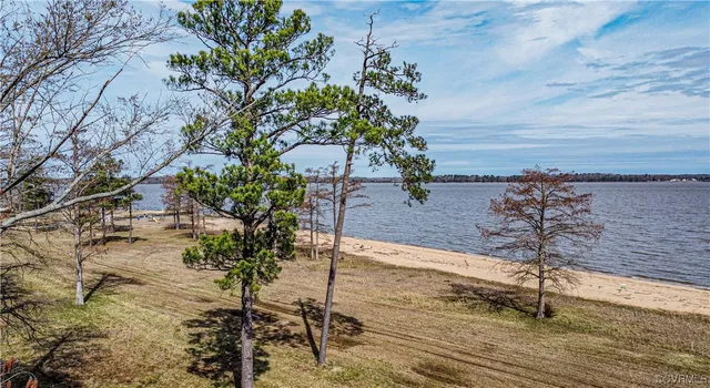a view of a water and beach in the back