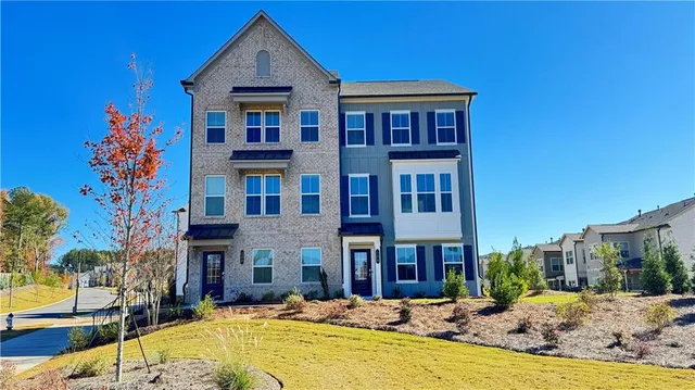 a large building with a large pool in front of it
