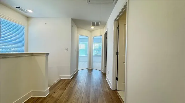 a bathroom with a bathtub shower sink vanity and toilet