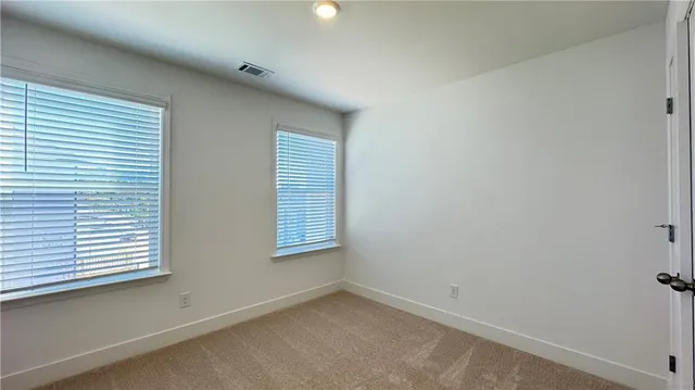 a view of a room that has a window in it