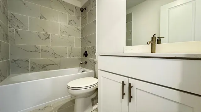 a view of hallway with wooden floor