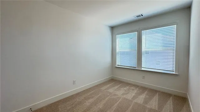 a view of a balcony with wooden floor and fence