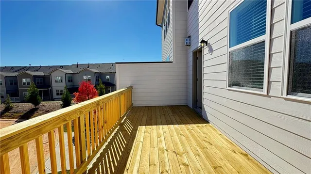 a view of pool with lawn chairs