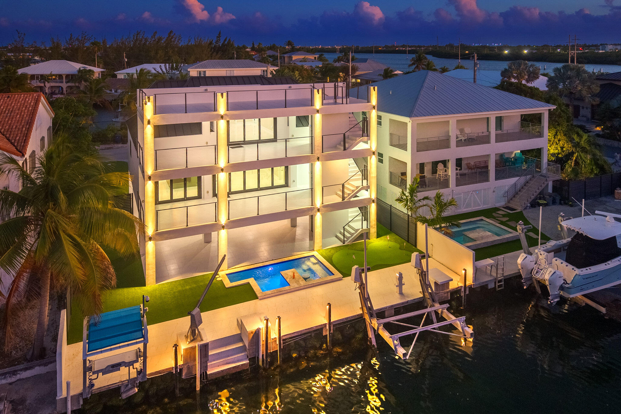 3 Evergreen Avenue Key Haven, FL 33040 - Photo 1 of 75 an aerial view of a balcony with chairs and a potted plant