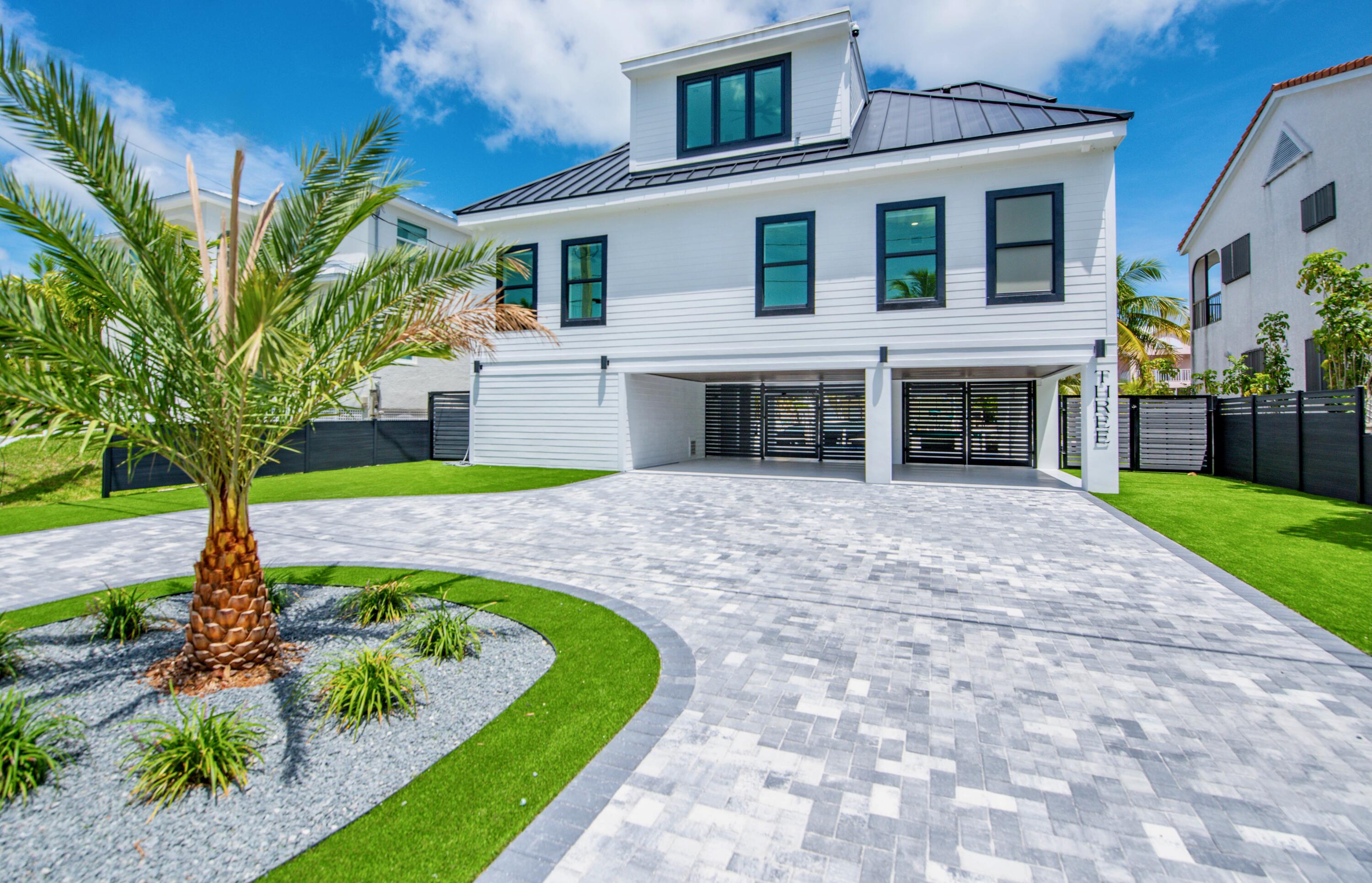 3 Evergreen Avenue Key Haven, FL 33040 - Photo 17 of 75 a front view of a house with a yard