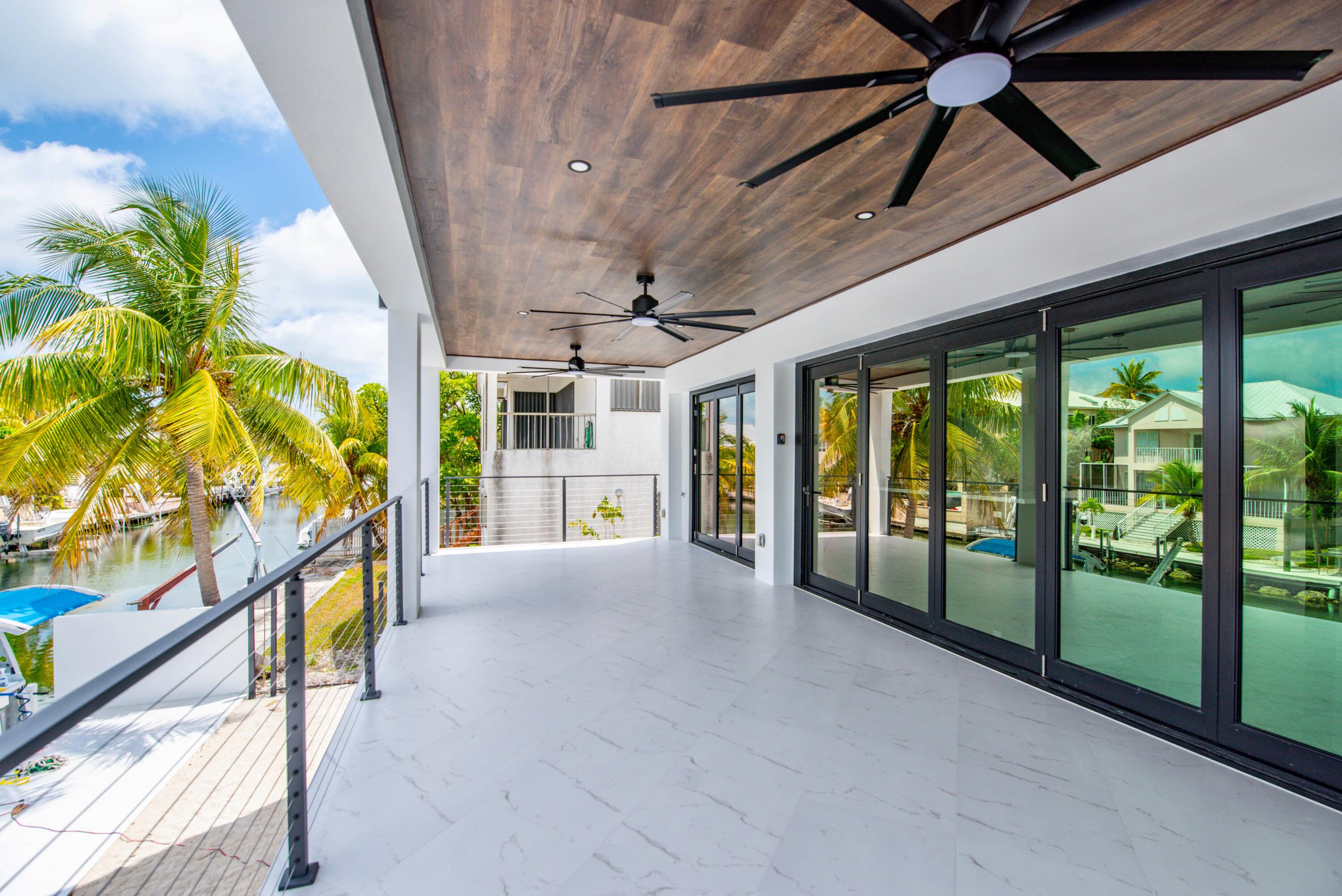 3 Evergreen Avenue Key Haven, FL 33040 - Photo 24 of 75 a view of an entryway with a floor to ceiling window
