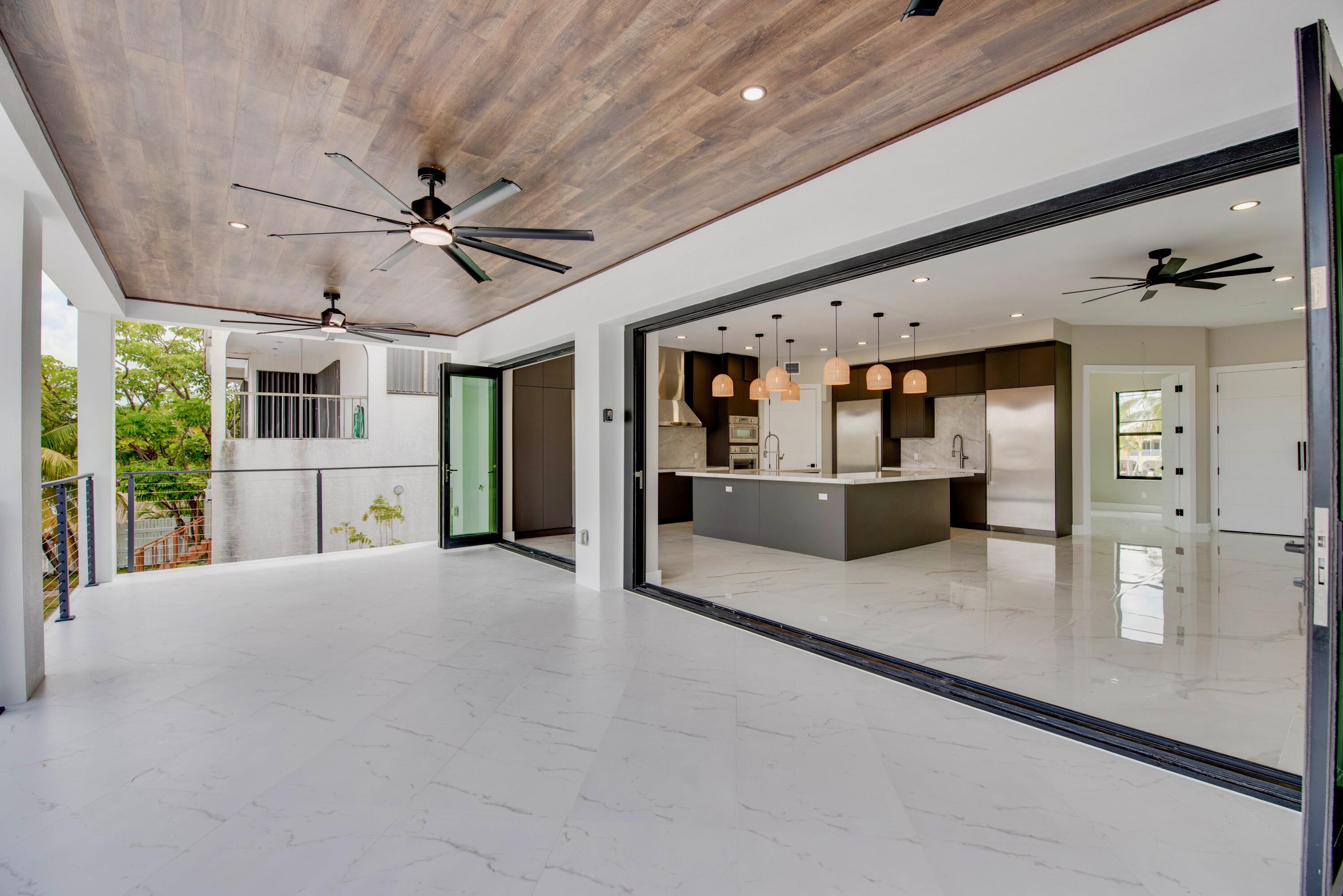 3 Evergreen Avenue Key Haven, FL 33040 - Photo 26 of 75 a view of a living room with furniture and a kitchen