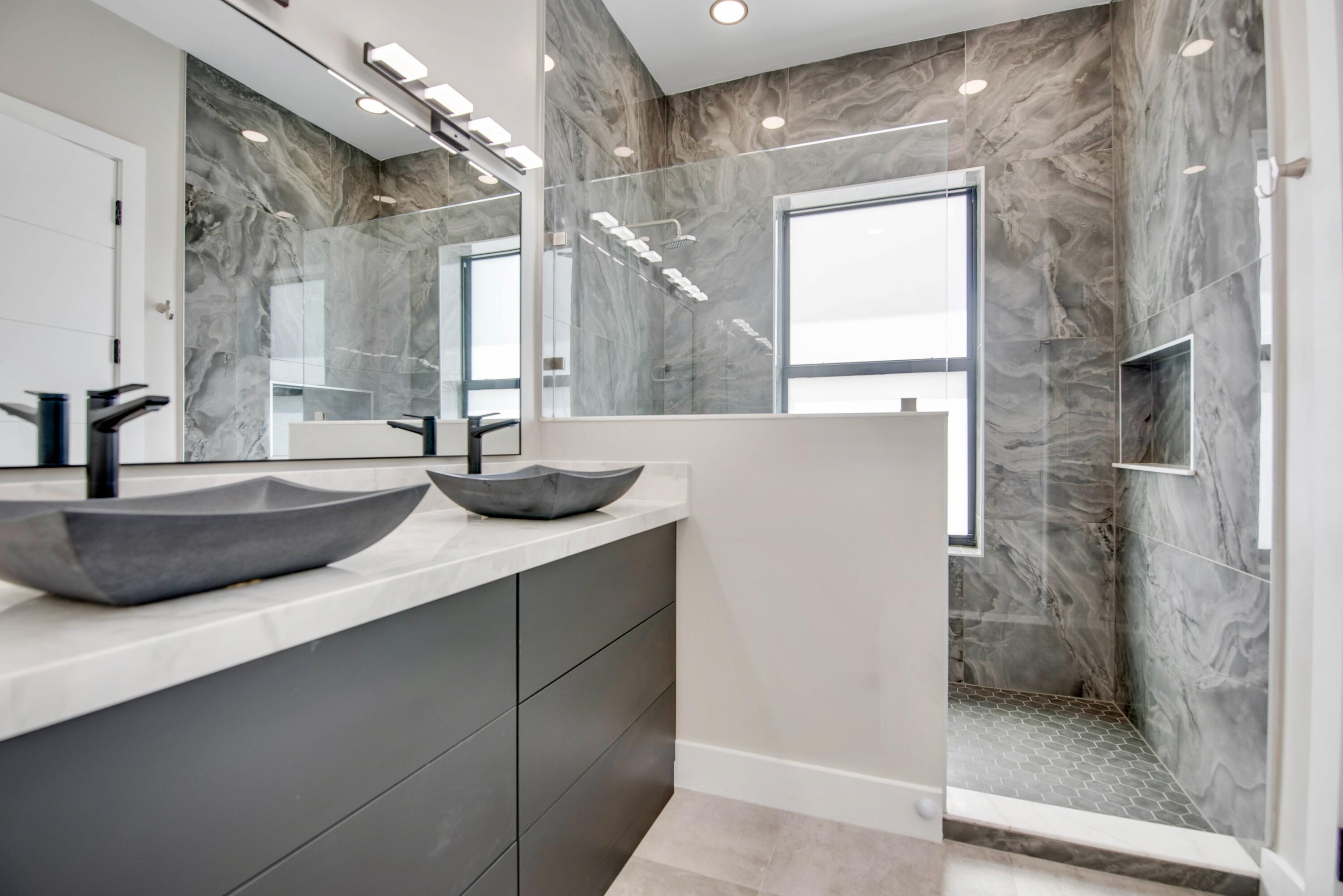 3 Evergreen Avenue Key Haven, FL 33040 - Photo 31 of 75 a bathroom with double vanity and a shower