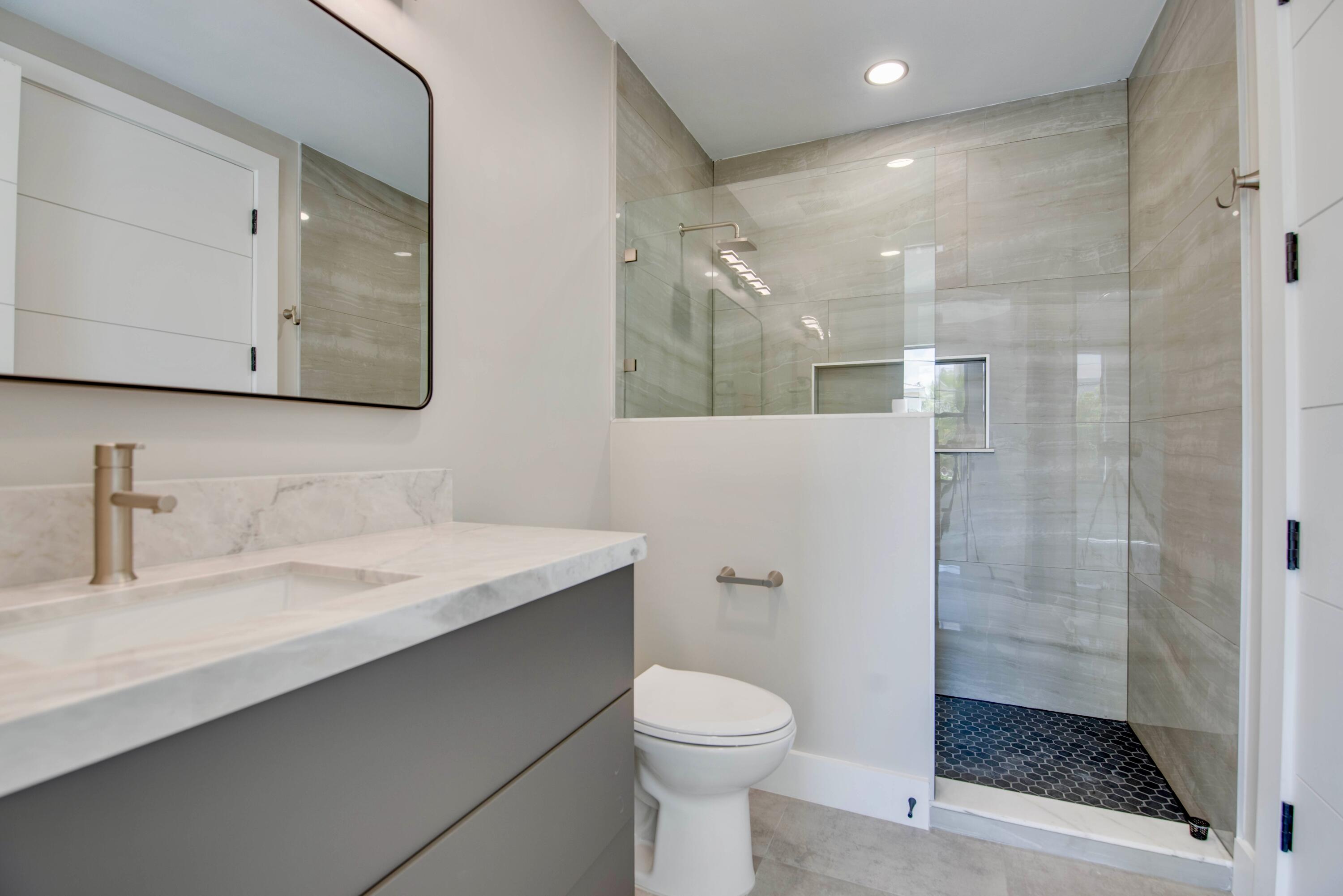 3 Evergreen Avenue Key Haven, FL 33040 - Photo 33 of 75 a bathroom with a sink a toilet and shower