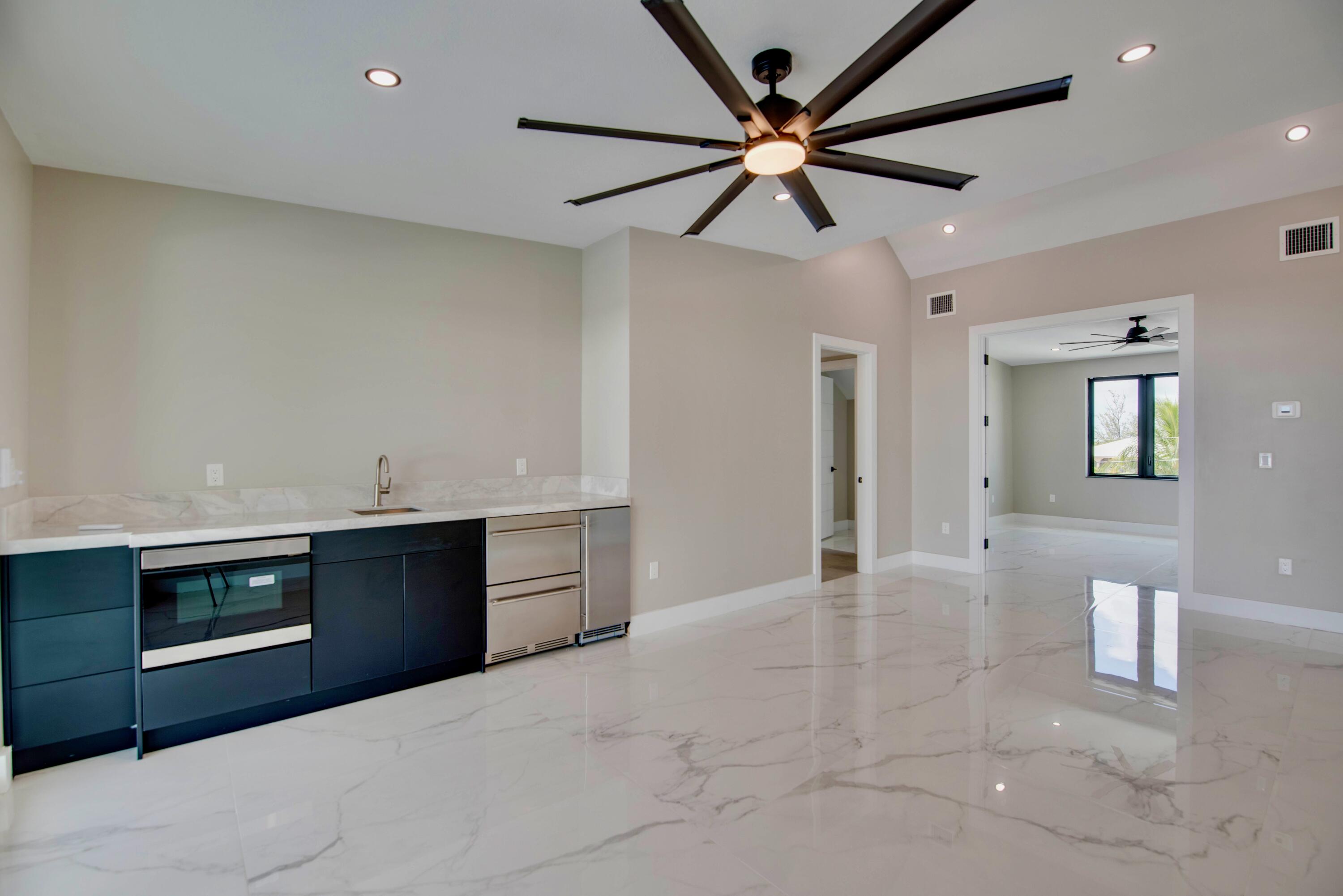 3 Evergreen Avenue Key Haven, FL 33040 - Photo 39 of 75 a view of a kitchen with a sink and a stove top oven