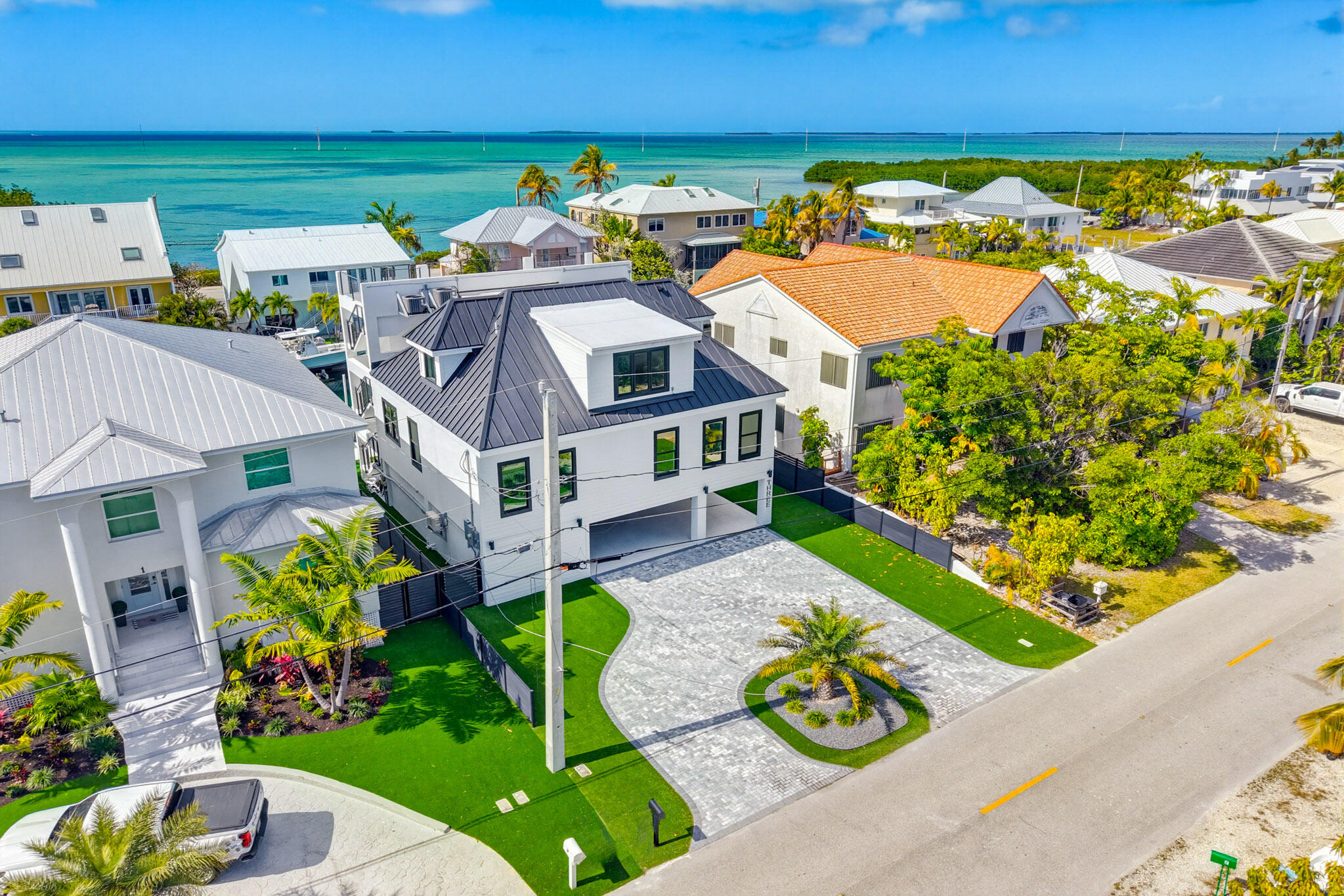3 Evergreen Avenue Key Haven, FL 33040 - Photo 66 of 75 a aerial view of a house with swimming pool lawn chairs and potted plants