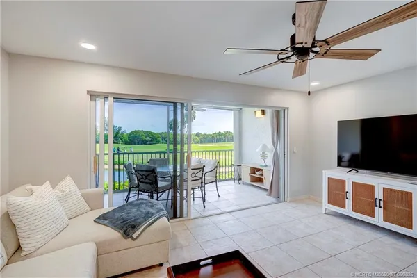 a view of a livingroom with furniture and flat screen tv
