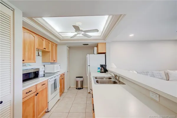 a kitchen with a stove and a refrigerator