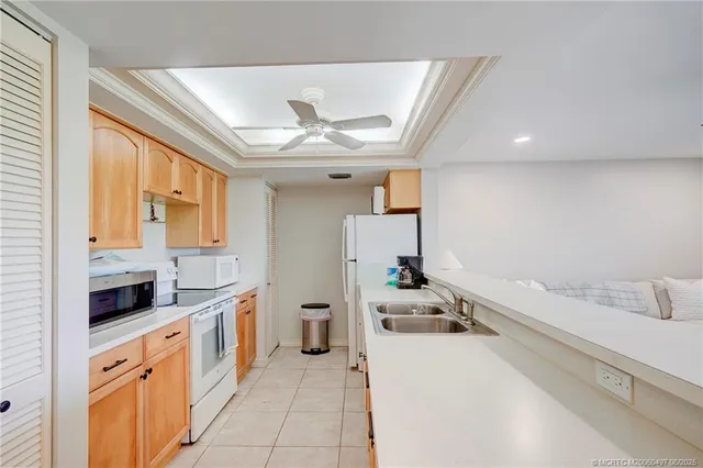 a kitchen with a stove and a refrigerator