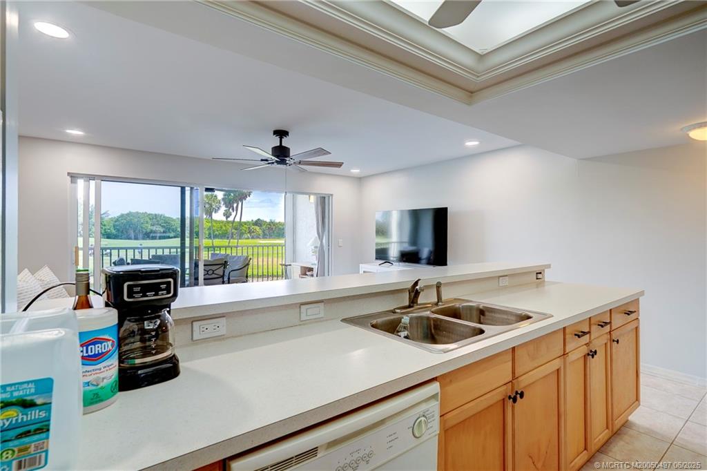 5539 Northeast Gulfstream Way Stuart, FL 34996 - Photo 10 of 26 a kitchen with a sink appliances and a large window
