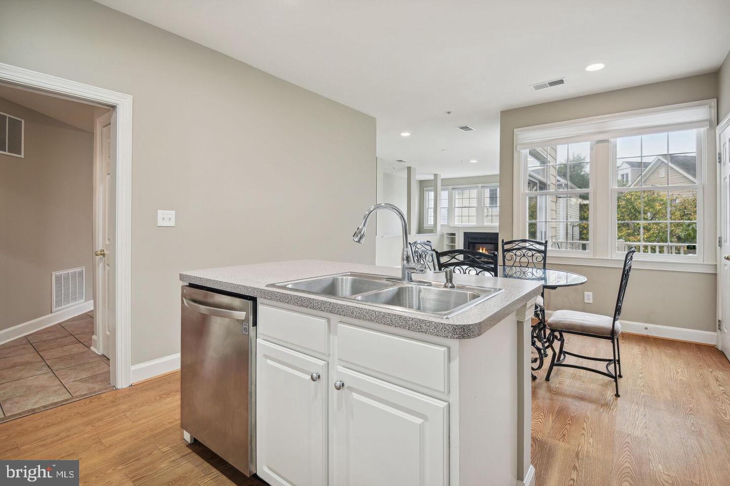 337 Main Street Gaithersburg, MD 20878 - Photo 6 of 35 a kitchen with a sink and chairs