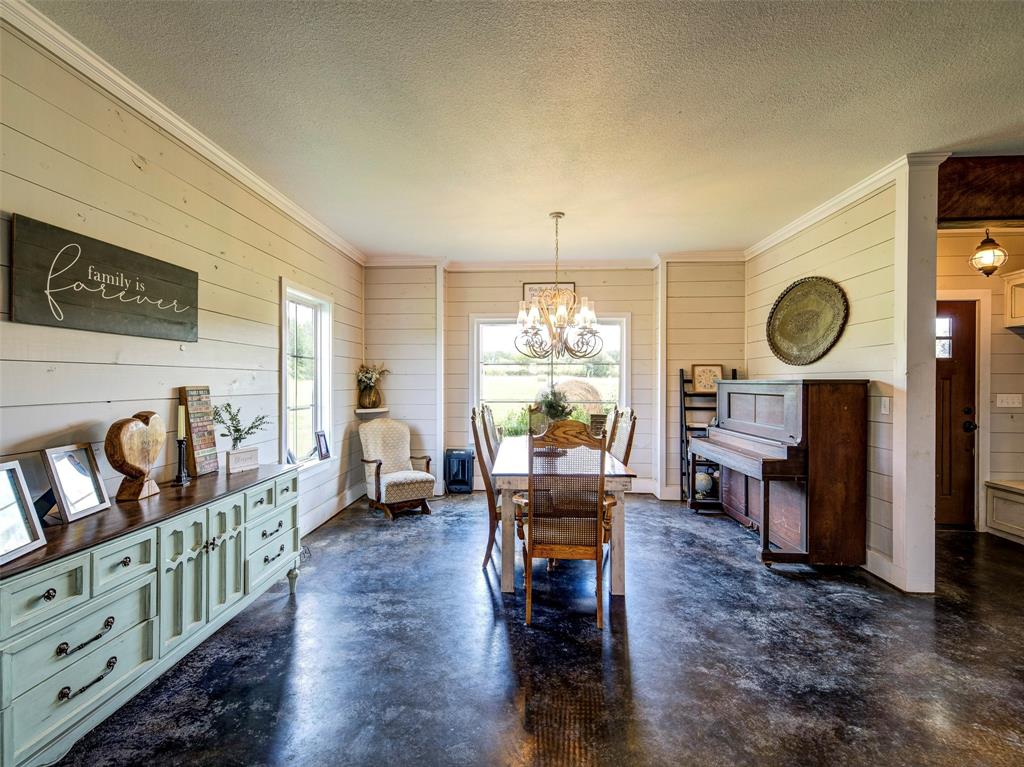 4983 Applegate Road Bowie, TX 76230 - Photo 13 of 40 a living room with fireplace furniture and a large window