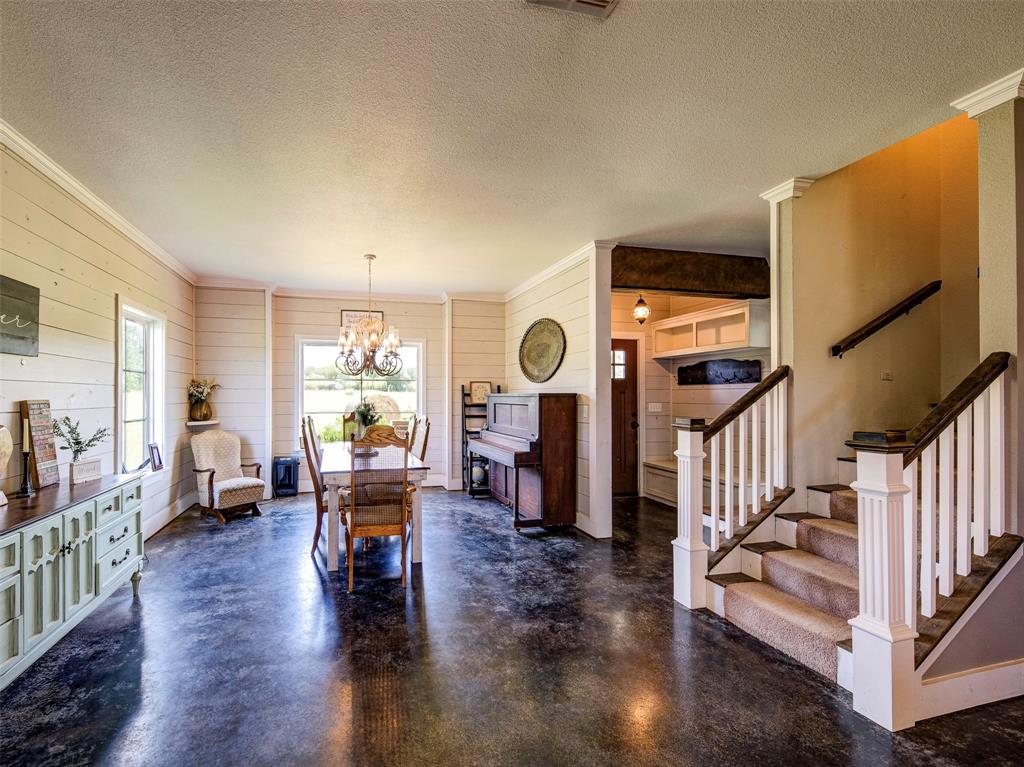 4983 Applegate Road Bowie, TX 76230 - Photo 14 of 40 a living room with fireplace furniture and a wooden floor