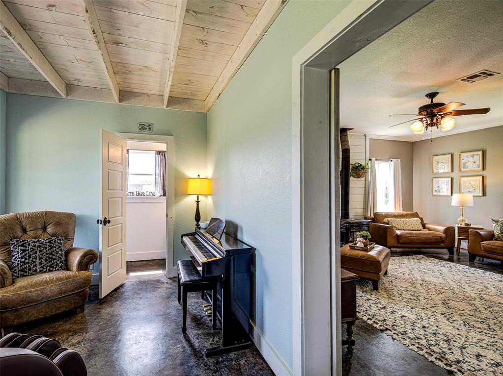 4983 Applegate Road Bowie, TX 76230 - Photo 15 of 40 a living room with furniture and wooden floor